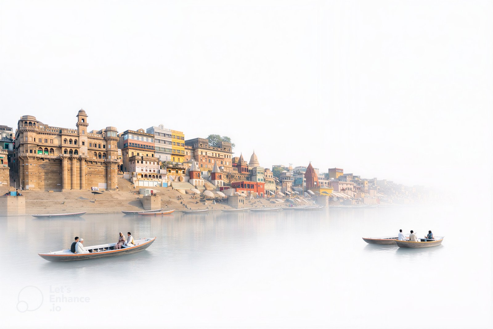 Varanasi ghats — the river, boats, and old city façades through morning mist.